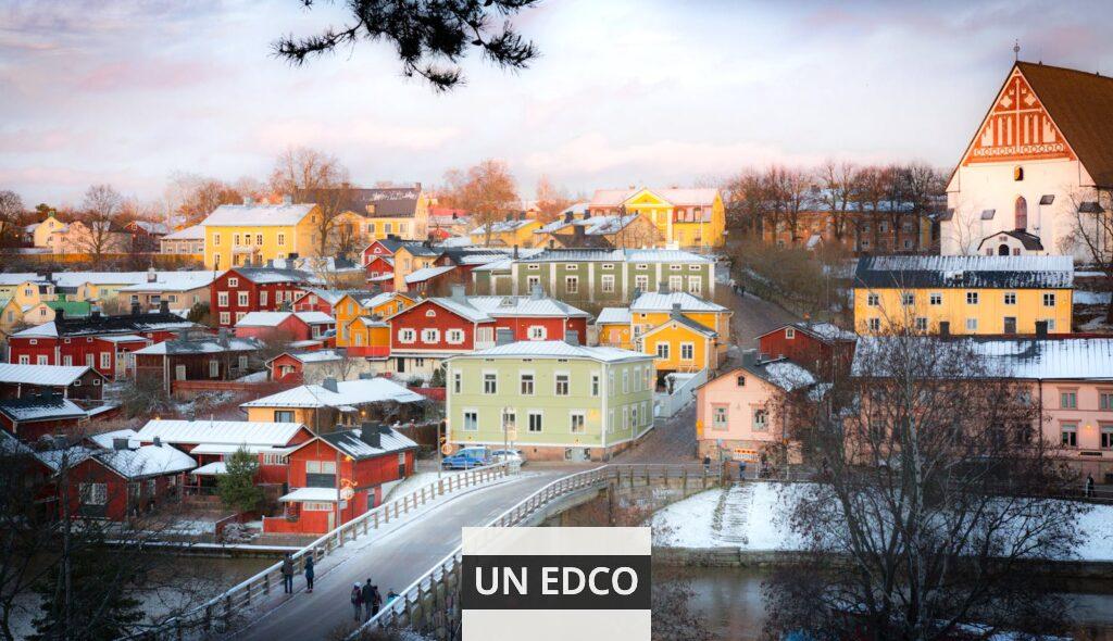 Captivating winter scene of colorful houses in Porvoo, Finland viewed from a bridge.