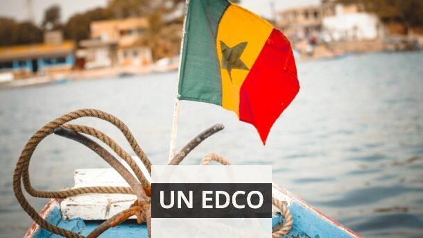 Colorful Senegalese flag and nautical ropes on a boat deck, perfect for travel themes.